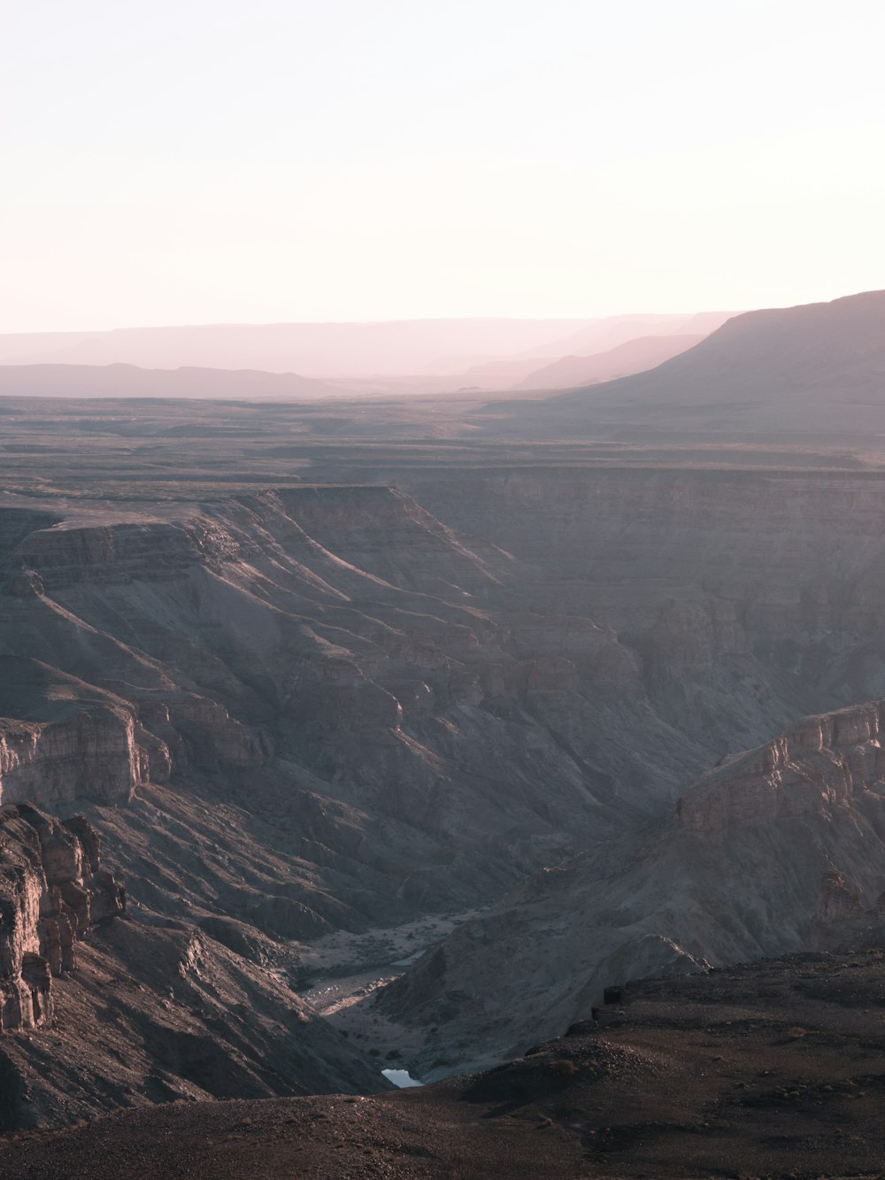 a large canyon with a river running through it