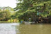 a couple of boats sit in a river