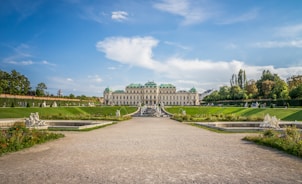 a large building with a fountain in front of it