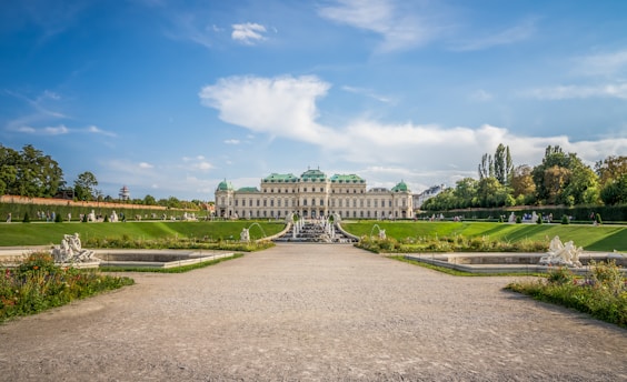 a large building with a fountain in front of it