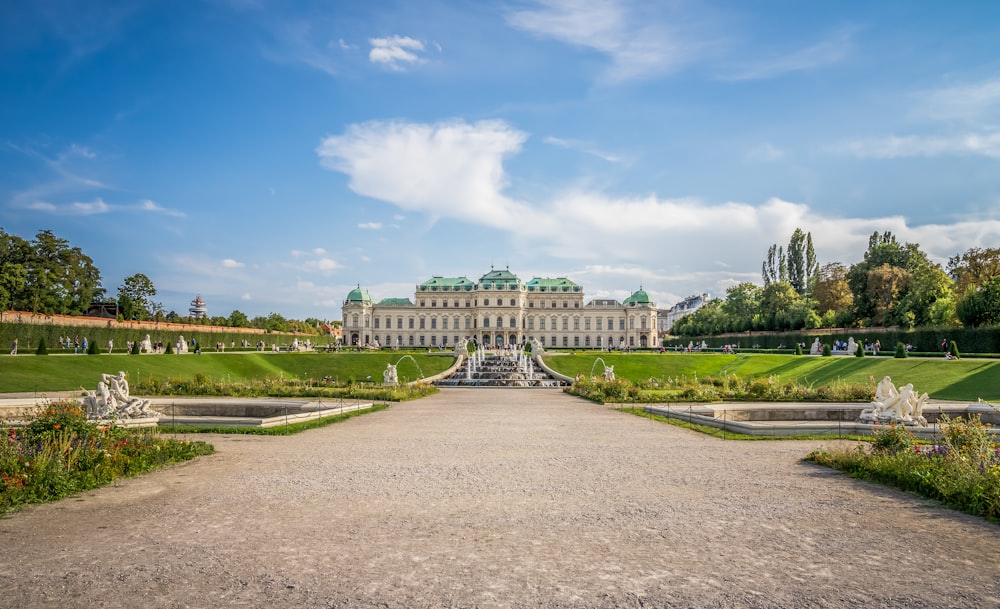 a large building with a fountain in front of it