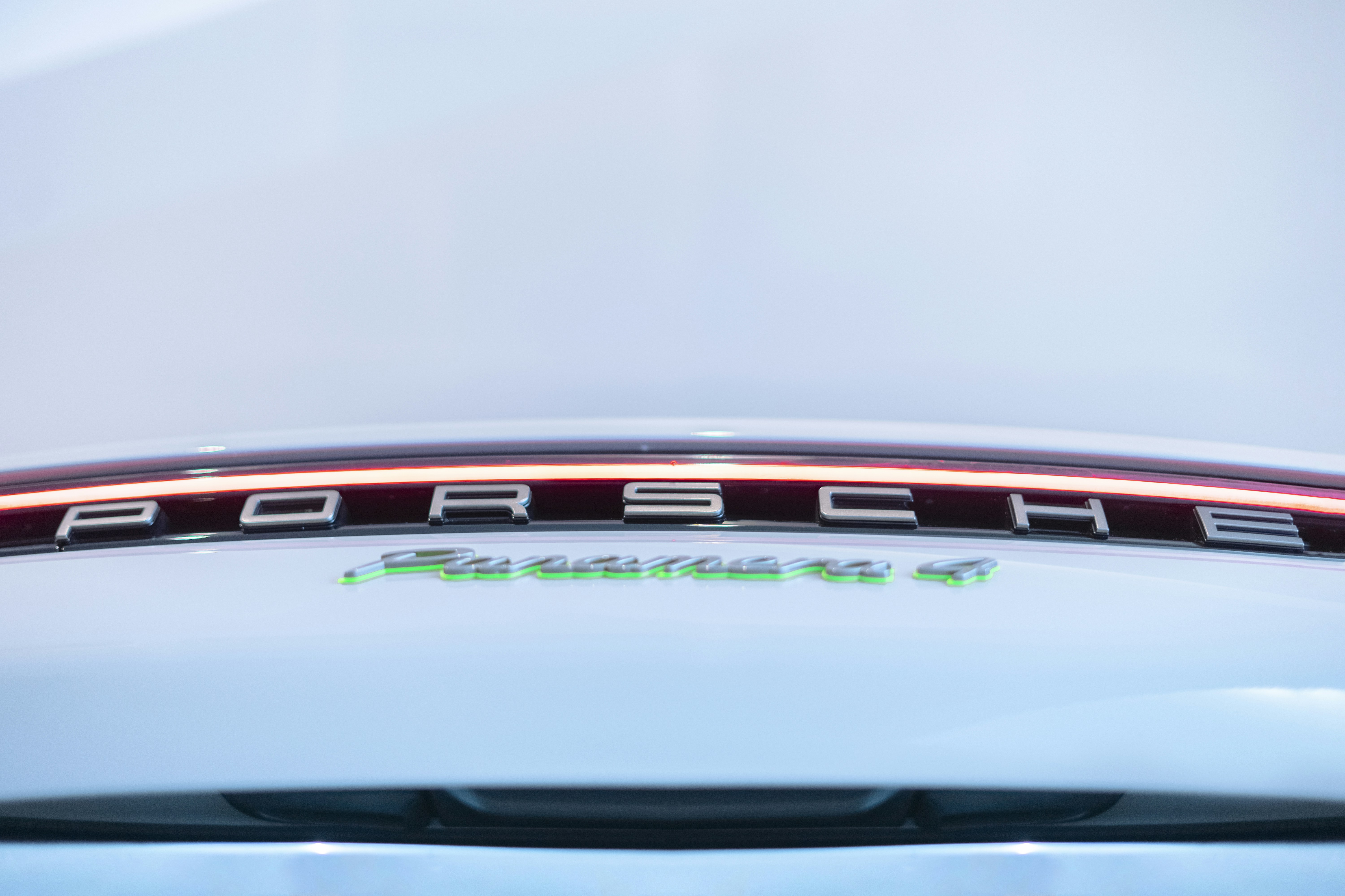 Lucid Air electric luxury sedan parked near a DC fast charger