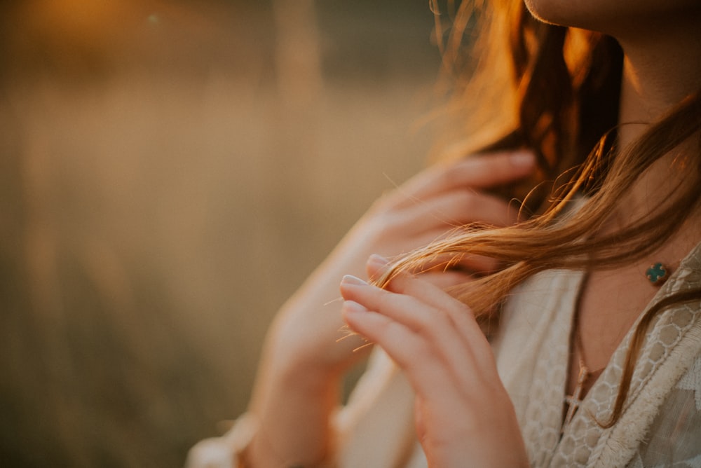 a woman with her hands together