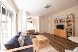 a living room with a blue couch