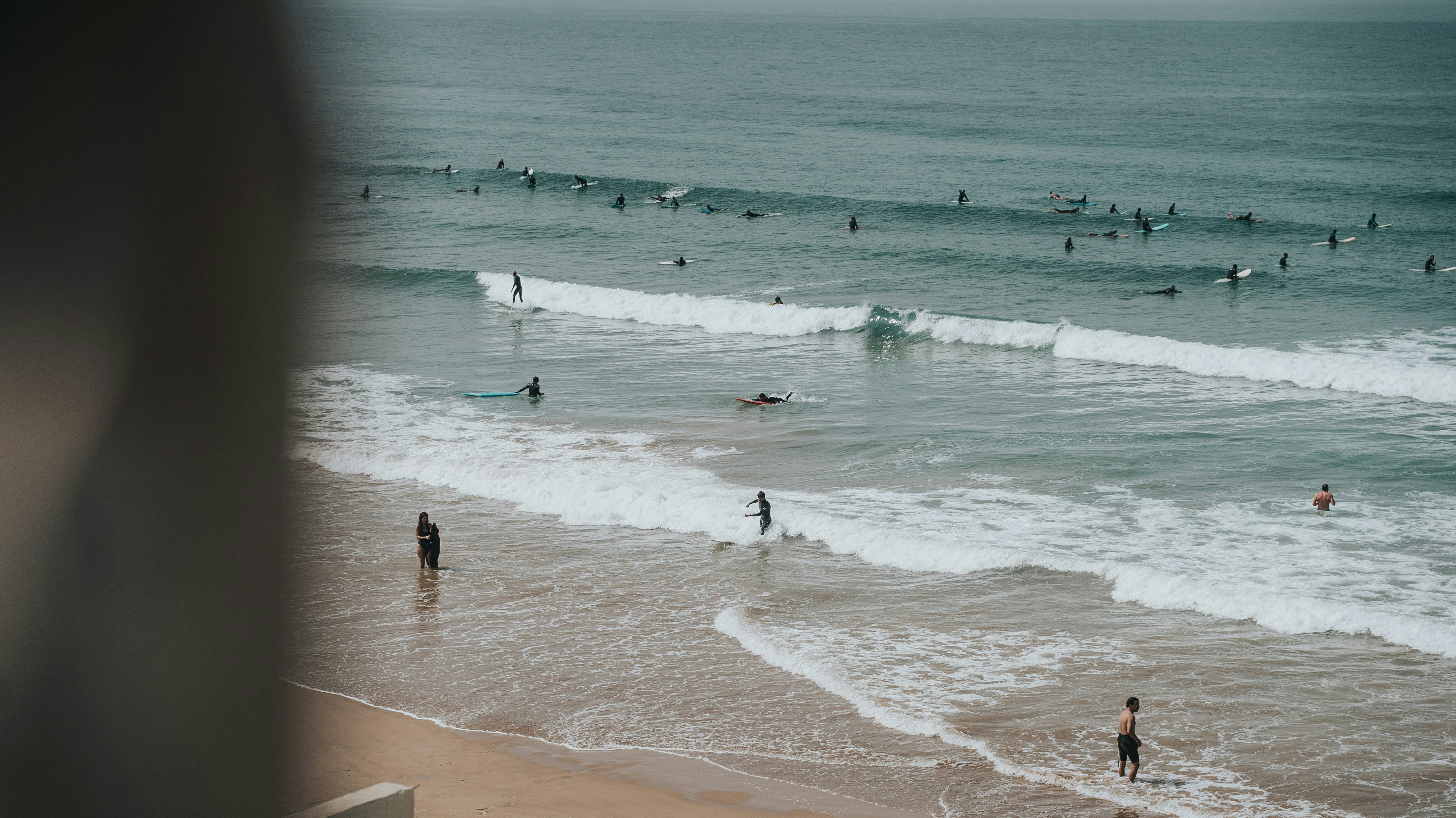 a group of people surfing in the sea