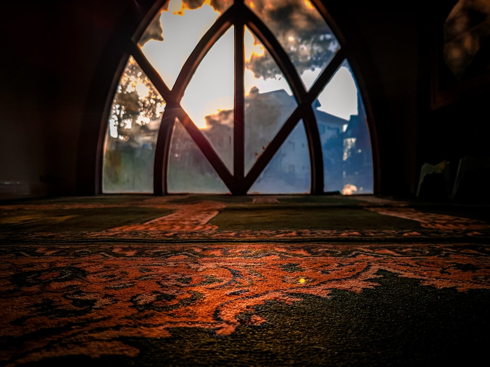 a window with a view of a street and trees