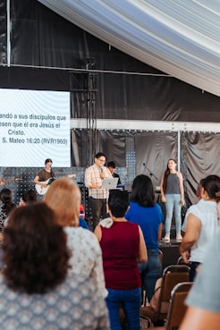 A vibrant Sunday service at Alas de Fe Ministries with joyful worship and engaged congregation.