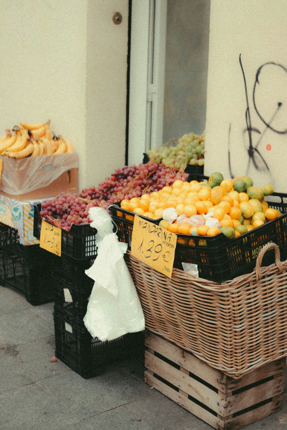 baskets of fruit on the sidewalk