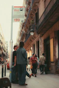 people walking on a sidewalk
