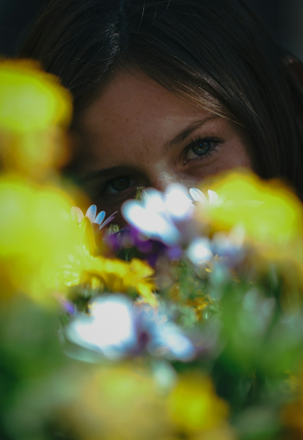a woman with a flower in her eye