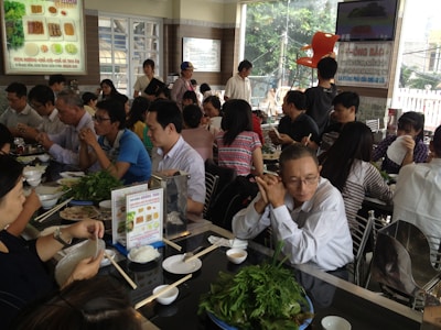 A lively dining room filled with happy guests enjoying their meals.