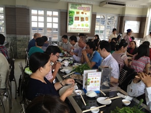 A lively dining area with friends enjoying a buffet meal together.