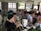 A busy restaurant with happy customers enjoying their meals.