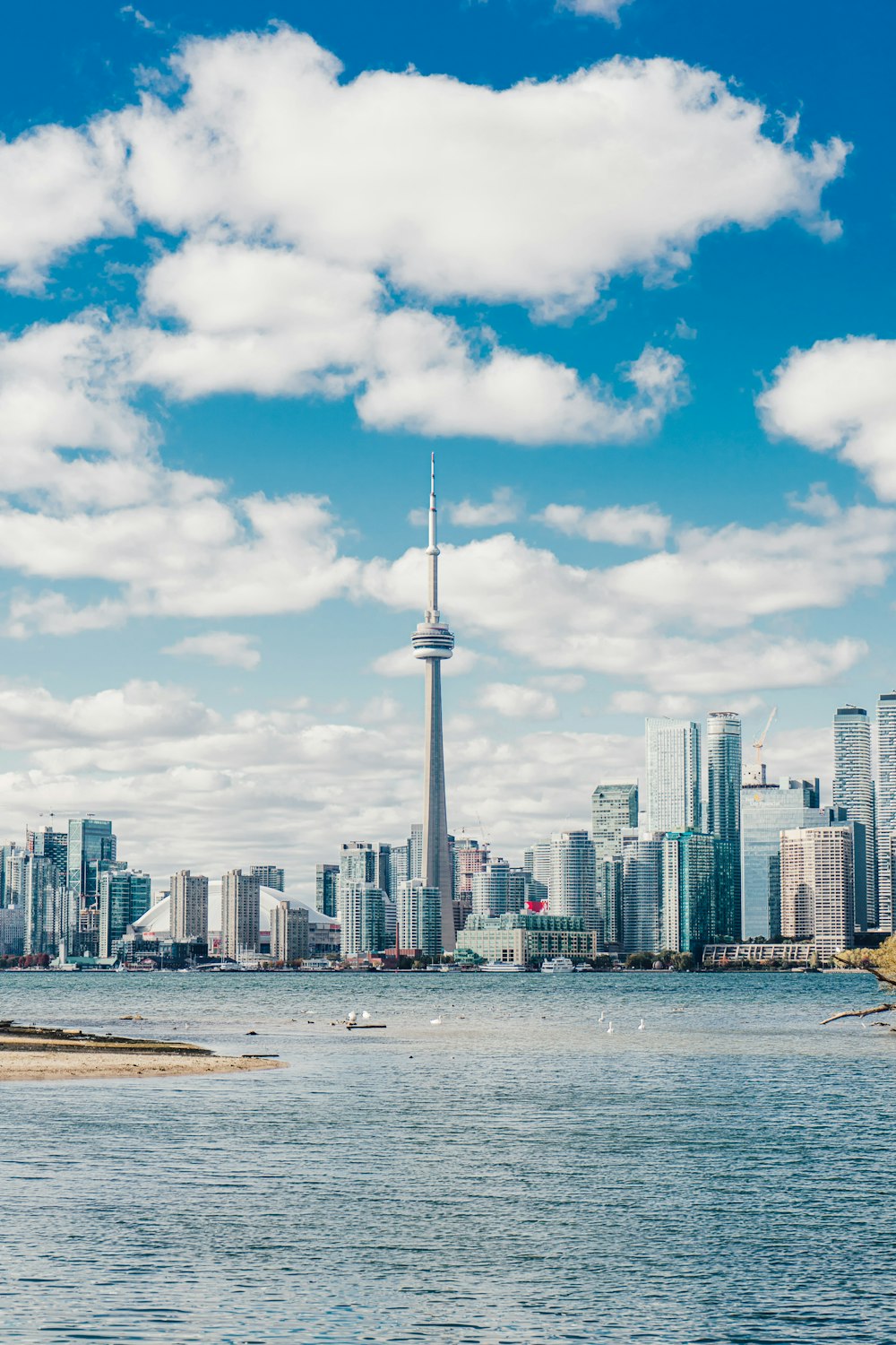 a city skyline with a tall pointy tower