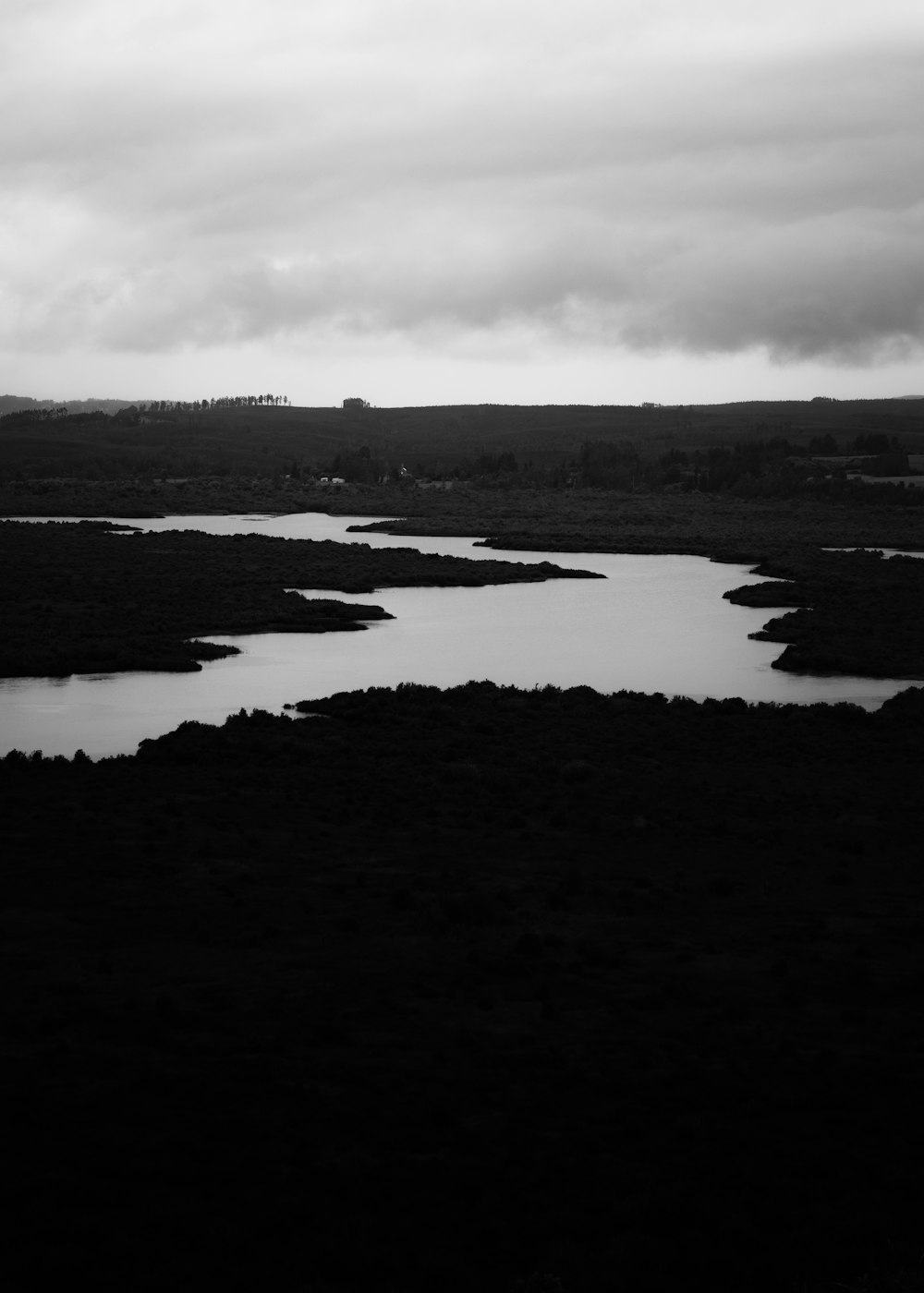 a body of water with land in the back