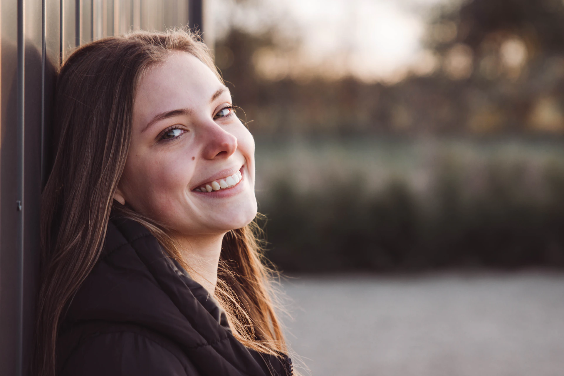 a woman smiling outside