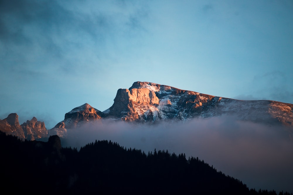 a mountain with fog around it