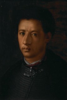 An elegant oil portrait of a man in renaissance clothing, showcasing deep shadows and highlights.