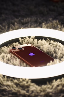 a cell phone on a blanket