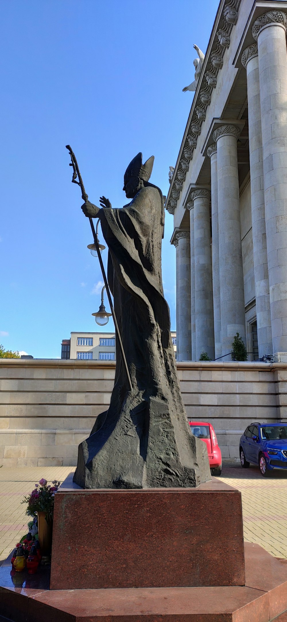 a statue of a dragon holding a sword