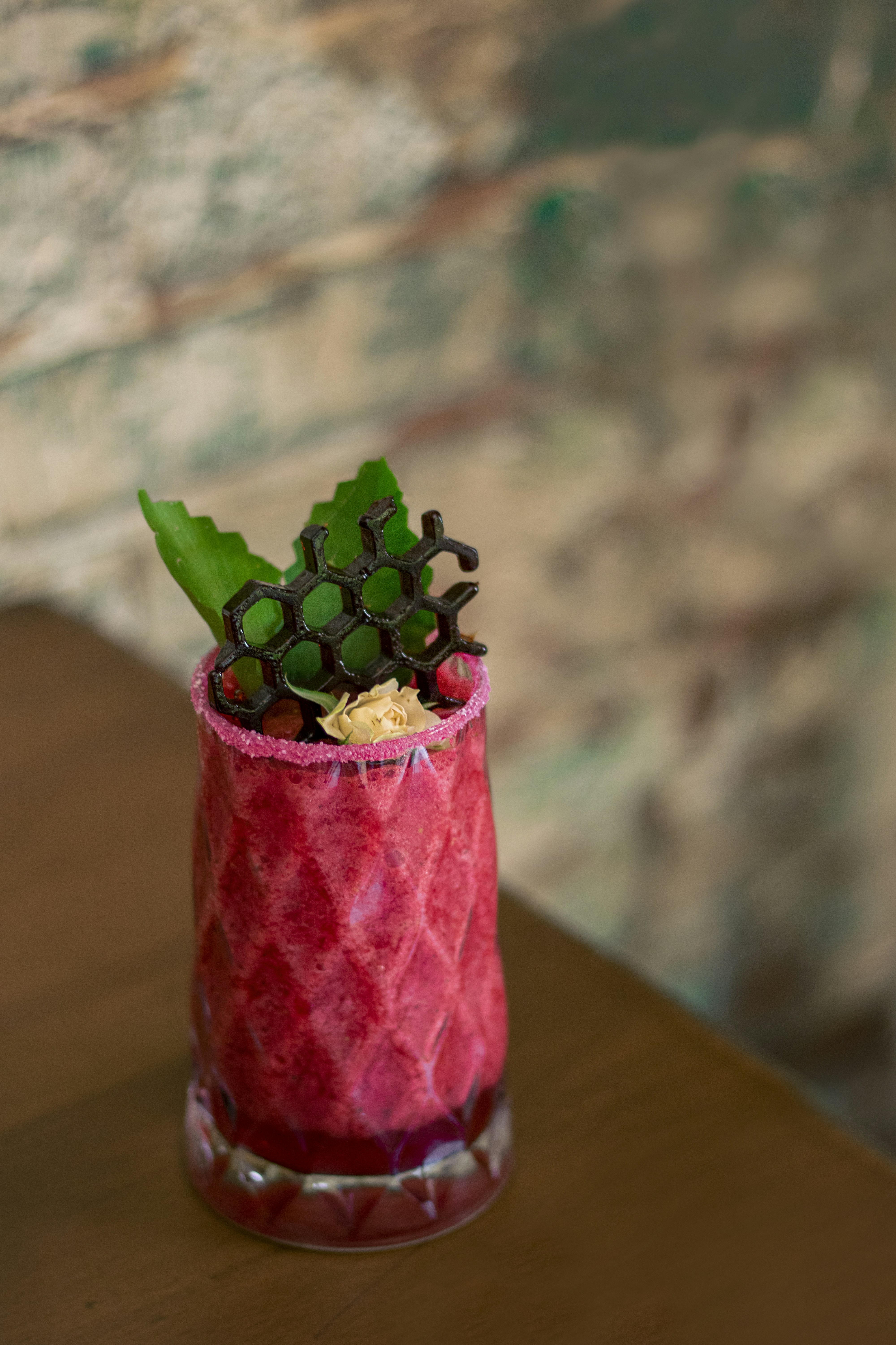 a glass with a plant in it