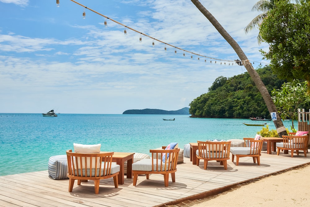 chairs on a deck overlooking a body of water