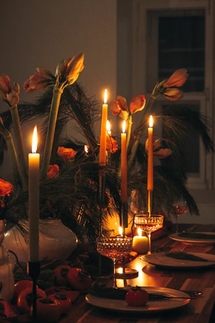 a table with candles and flowers