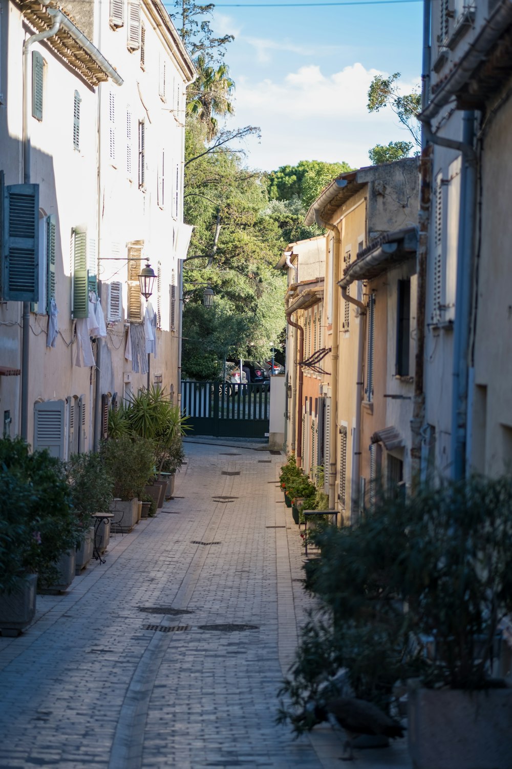 a narrow street with buildings on both sides