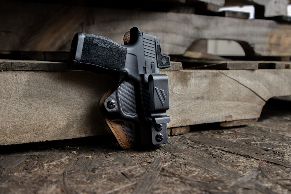 a gun on a wood surface