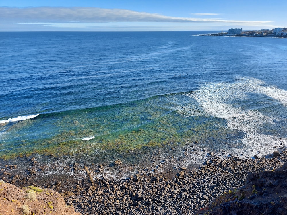 a rocky beach with waves crashing