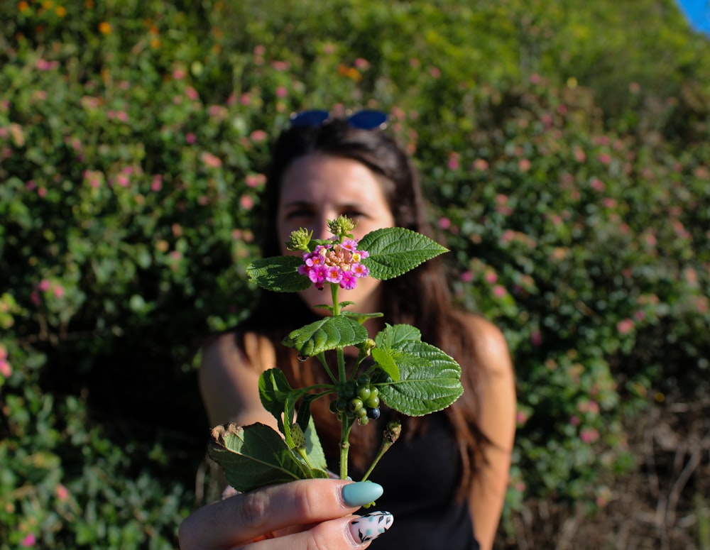 a person holding a flower