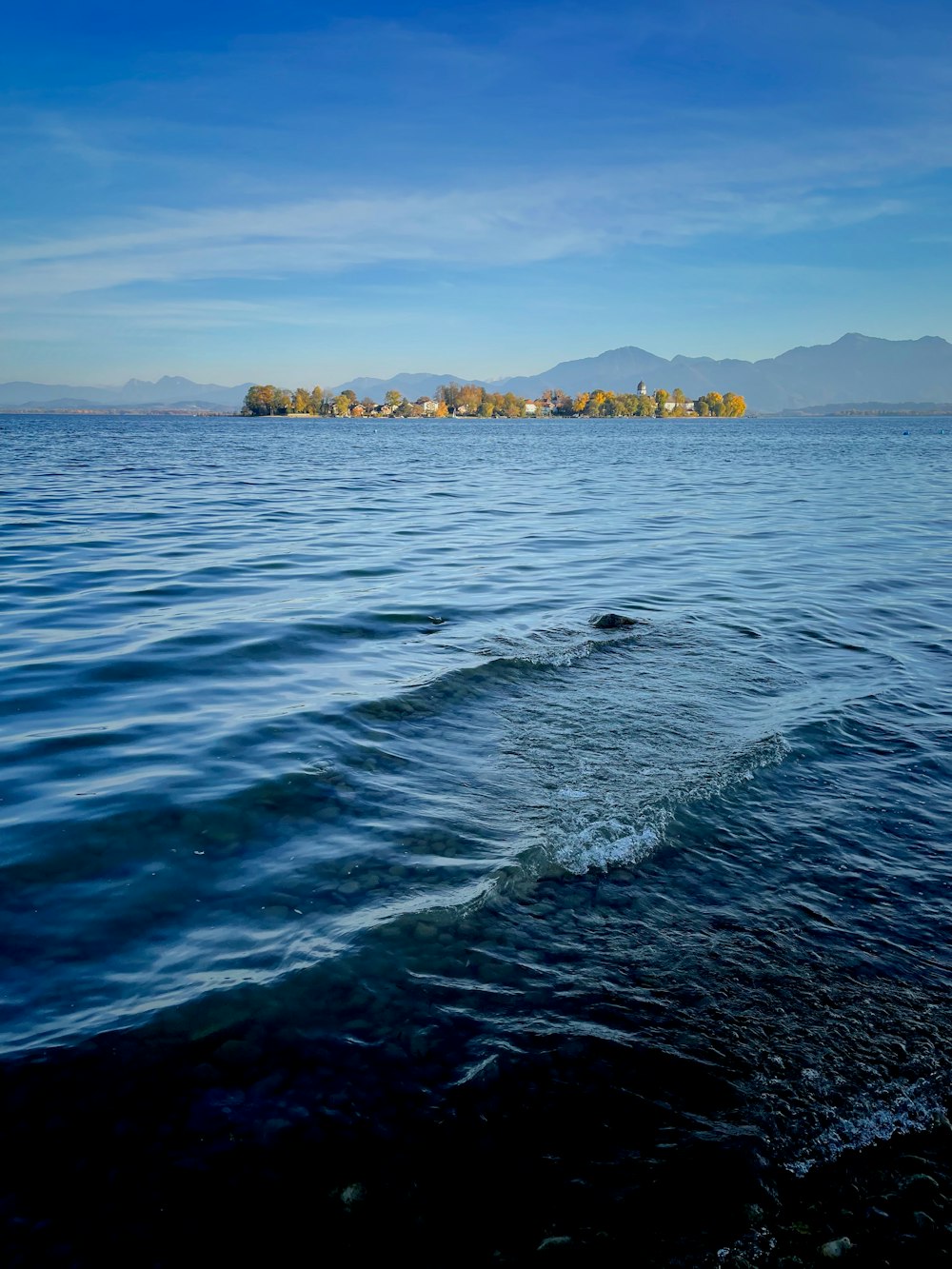 a body of water with a land in the distance