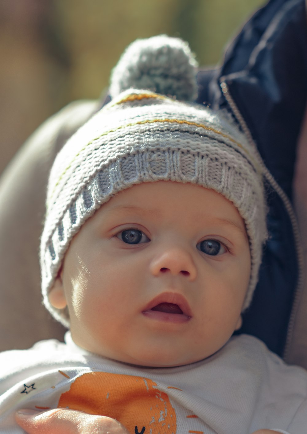 a baby wearing a white hat