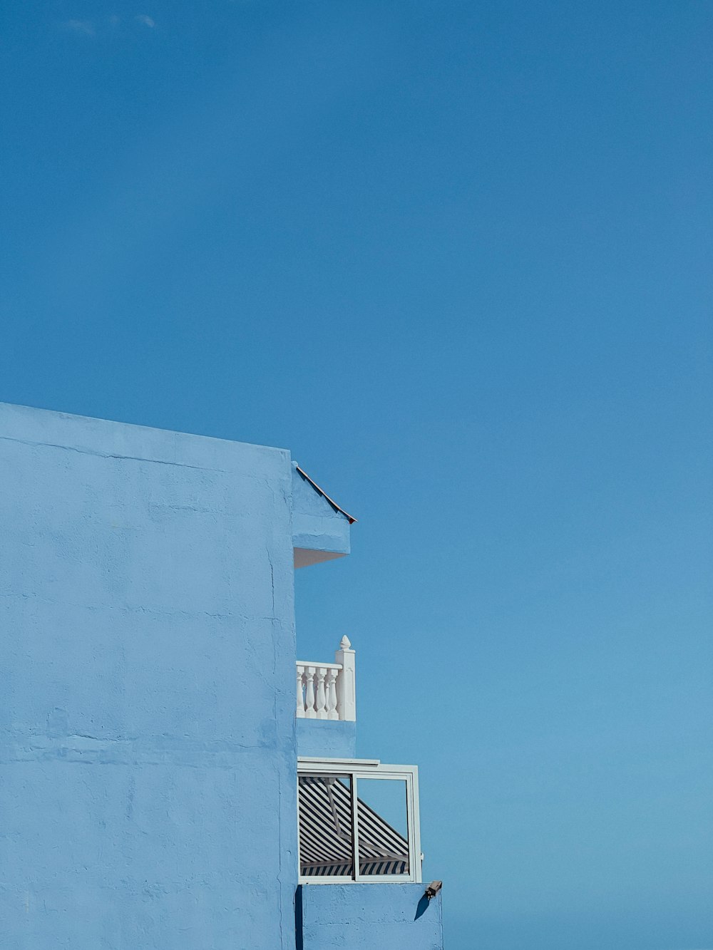 a white building with a blue sky