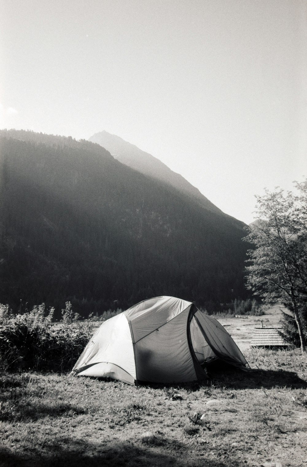 a tent in front of a mountain