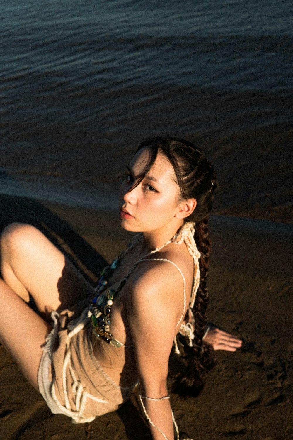 a woman in a garment on a beach