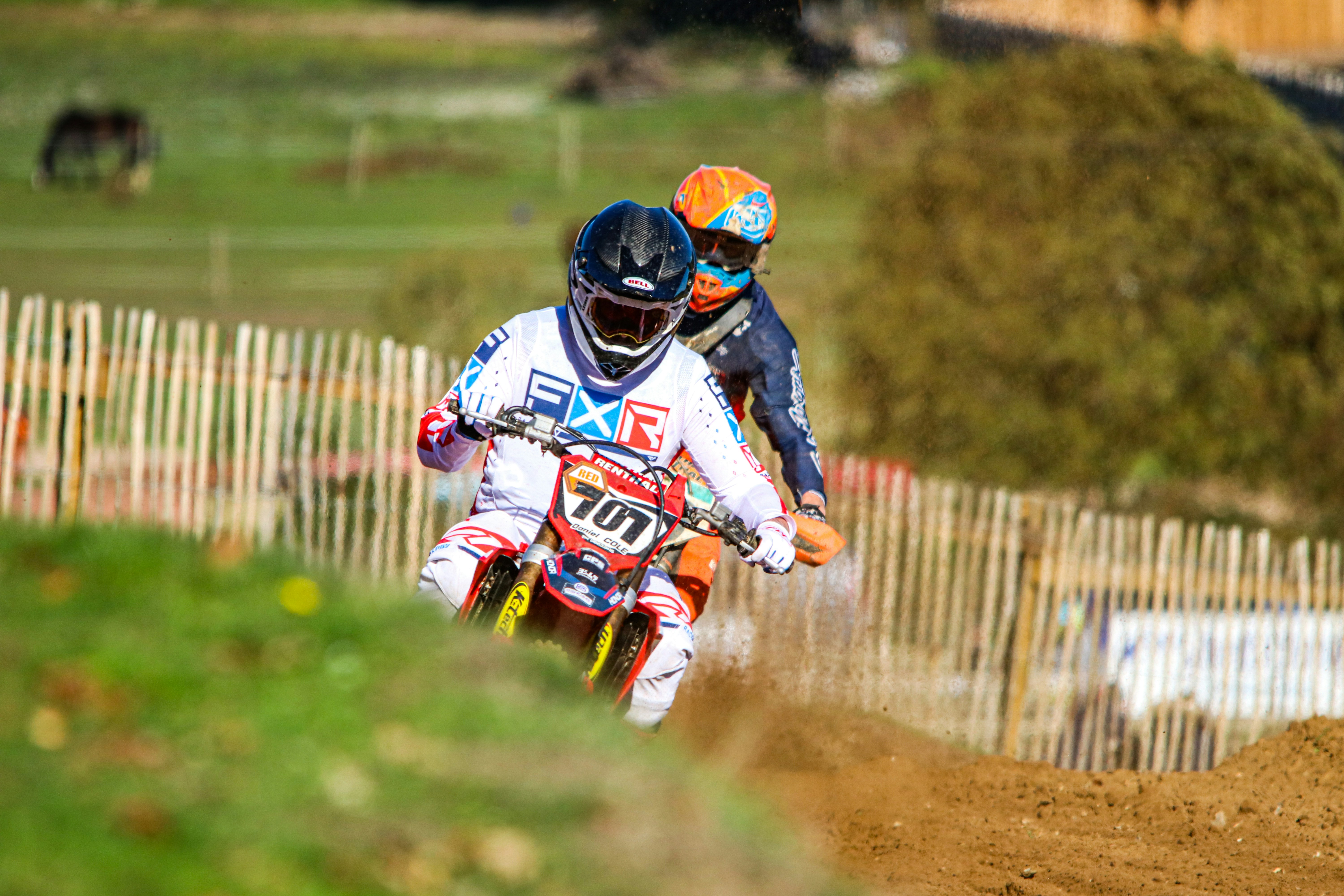 A couple of people racing on a motorcycle photo – Free Uk Image on Unsplash