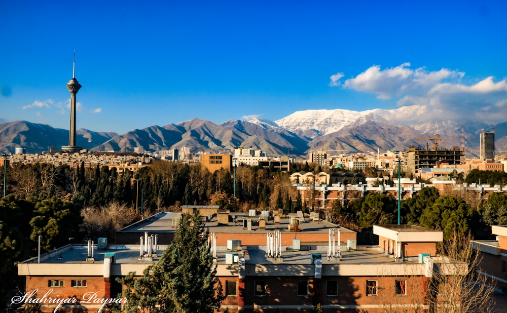 a city with mountains in the background