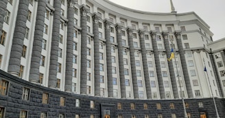 a building with flags on the roof