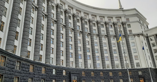 a building with flags on the roof
