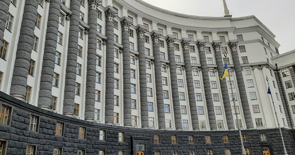 a building with flags on the roof