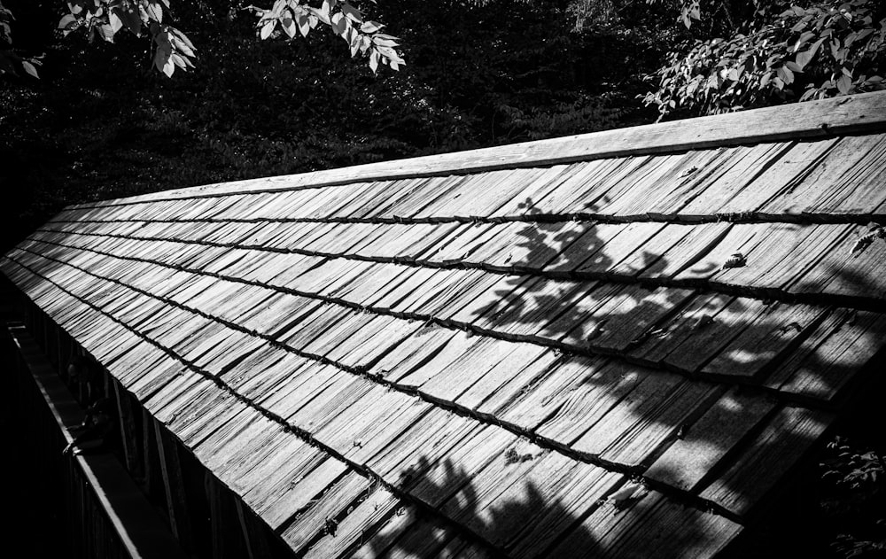 a wooden bridge with a railing