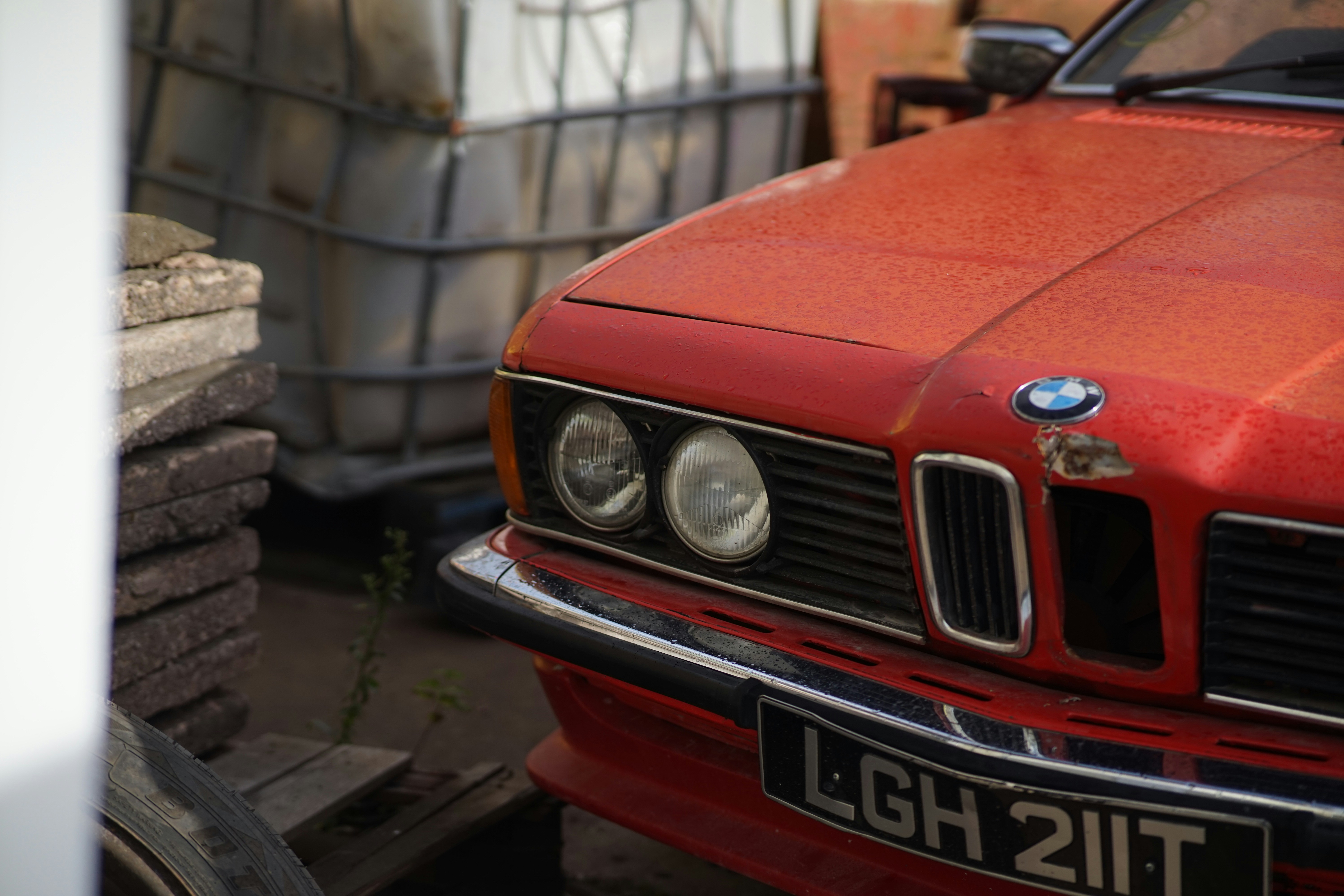 a red car parked in a driveway