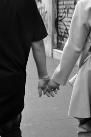 a man and woman holding hands