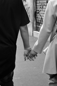a man and woman holding hands
