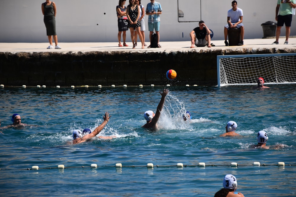 a group of people playing water polo