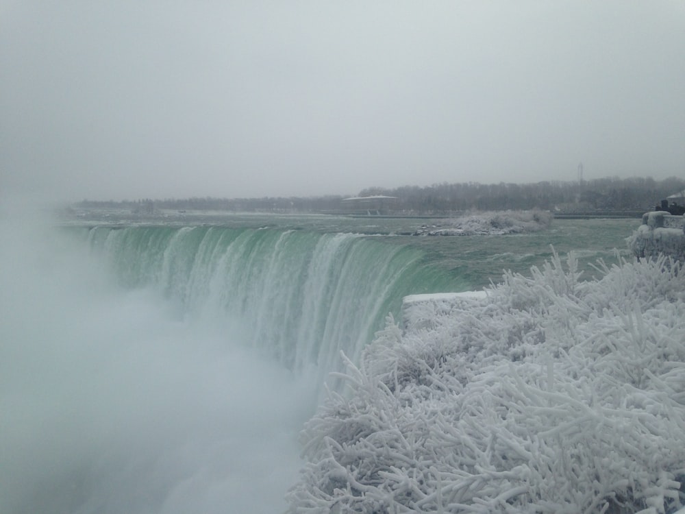 a large waterfall with a large waterfall