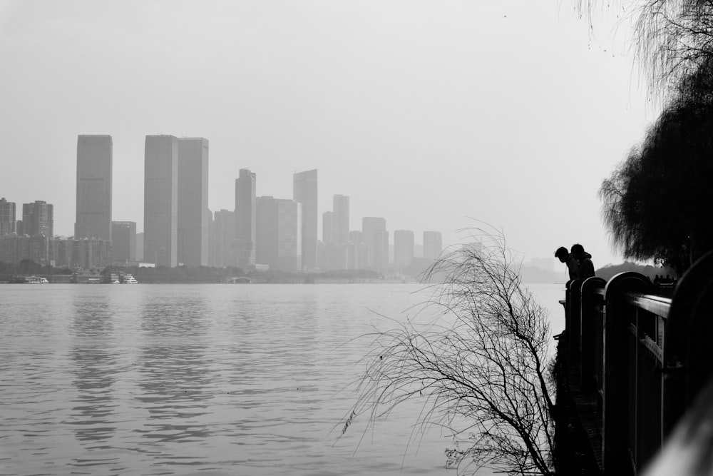 a body of water with a city in the background