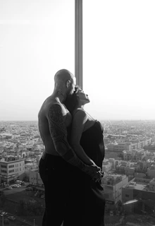 a person with tattoos and a tattoo on the arm