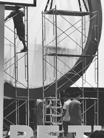 Workers assembling scaffolding.